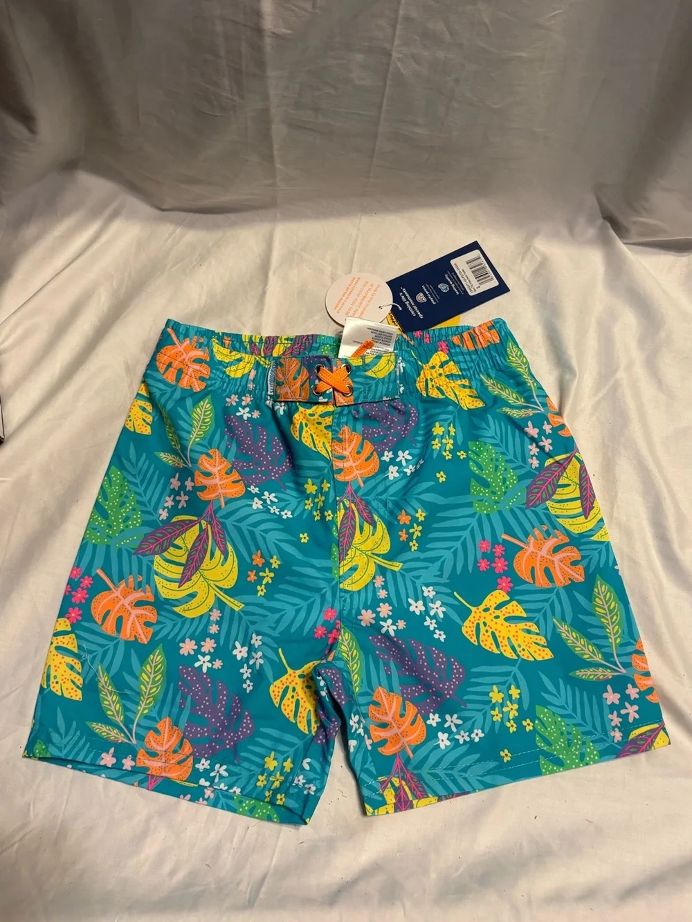 Boys Teal Tropical Leaf Swim Trunks with Bright Print